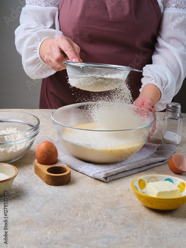 Wallpaper Mural Step-by-step preparation of thin pancakes or crepes on a light background. A woman prepares pancake dough, sifts flour into a mixture of milk and eggs. Torontodigital.ca