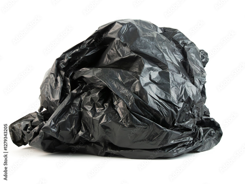 Fototapeta premium Crumpled black trash bag on a white background