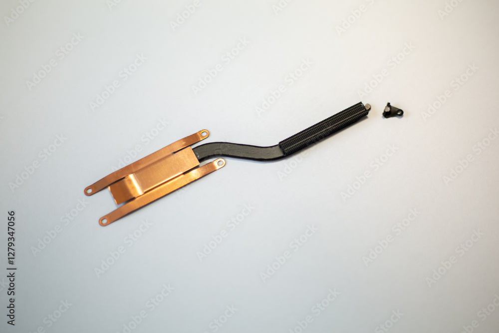 An image displaying laptop component of the CPU heatsink set on white background. The photo may be useful for information around laptop repair, replacement, and general concepts regarding laptop An image displaying laptop component of the CPU heatsink set on white background. The photo may be useful for information around laptop repair, replacement, and general concepts regarding laptop