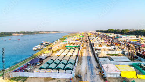Aerial view tent city at The Maha Kumbh Mela in Prayagraj, Uttar Pradesh at the Triveni Sangam in Prayagraj, Uttar Pradesh, India. The Mahakumbh Mela is a Hindu festival that happens every 12 years.