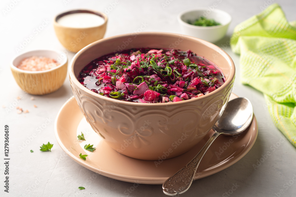 Cold borscht or Holodnik or Svekolnik, traditional summer beet soup in ceramic bowl on concrete background Cold borscht or Holodnik or Svekolnik, traditional summer beet soup in ceramic bowl on concrete background