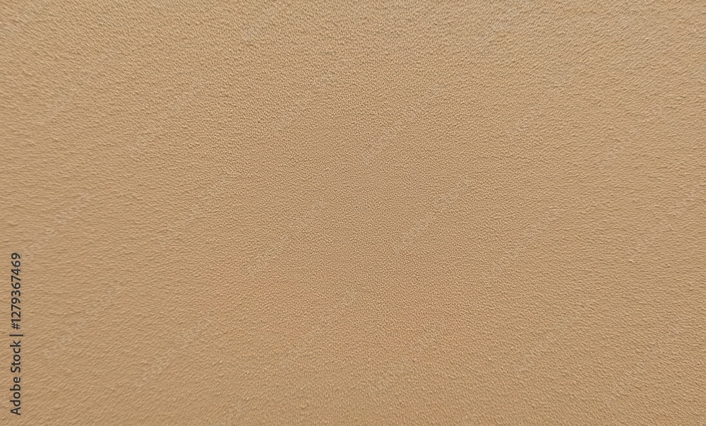 Textured sandy beige wall surface. Textured sandy beige wall surface.