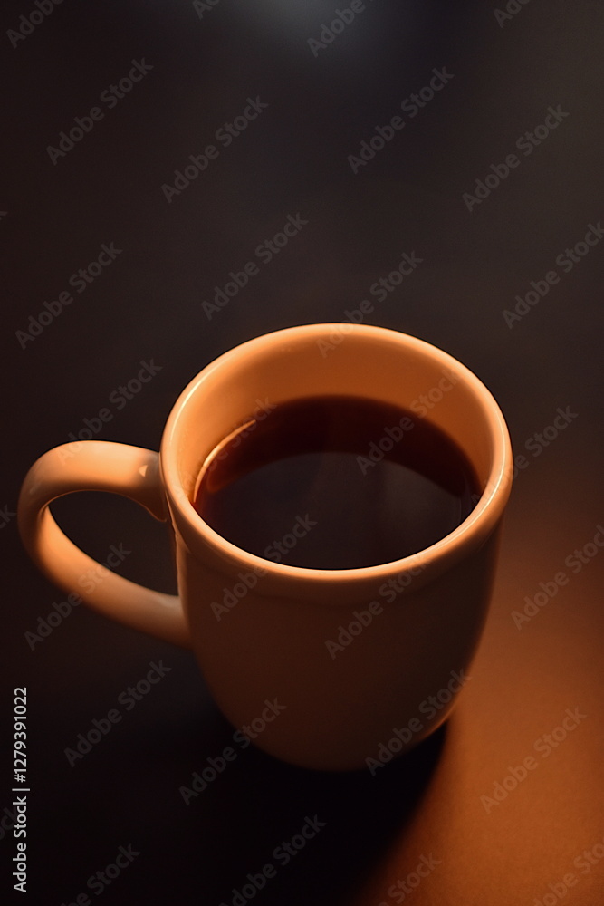 White cup with black hot coffee on the table White cup with black hot coffee on the table