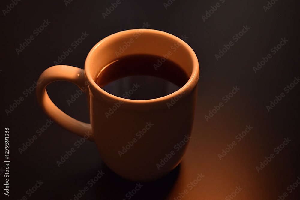 White cup with black hot coffee on the table White cup with black hot coffee on the table