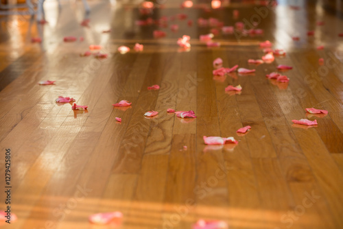 rose petals on hardwood floor 