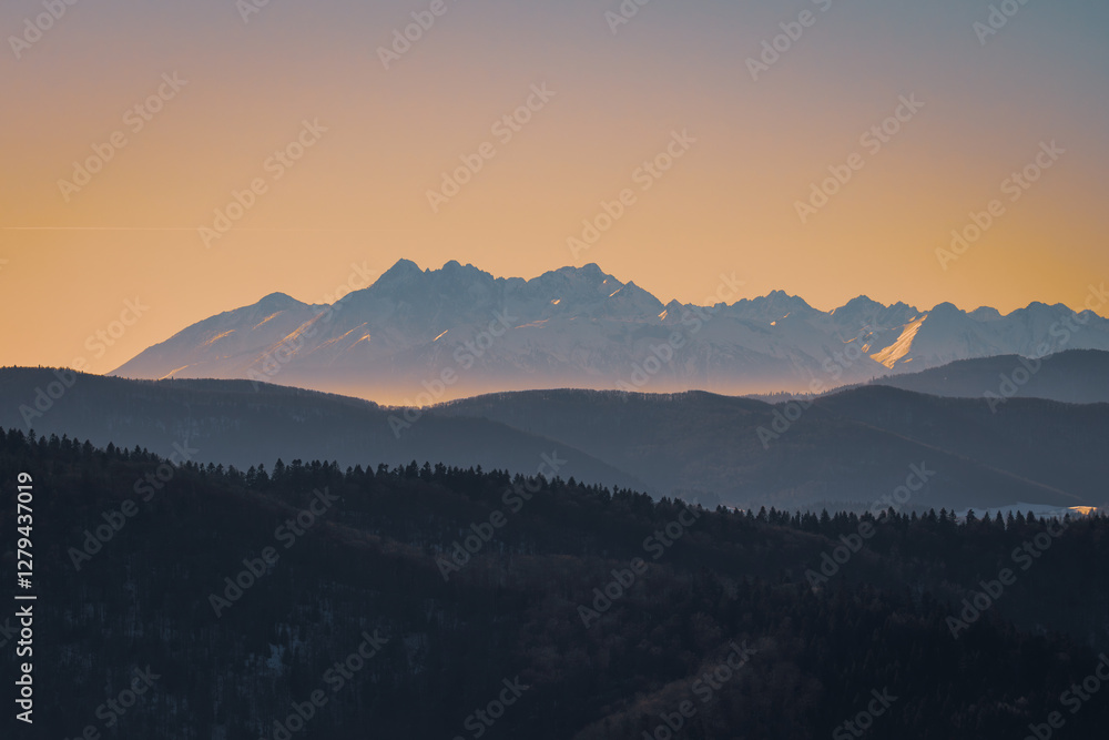 Obraz premium Tatra Mountains, Poland. Panorama of a mountain landscape. View from Jaworze. Sunset over the mountains