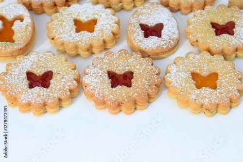 Linzer cookies filled with strawberry and apricot jam, copy space for text. Easter baking photo