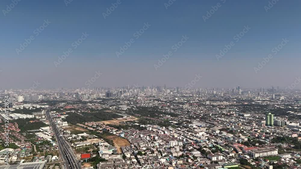 Sunny industrial suburban area with buildings and highway Sunny industrial suburban area with buildings and highway