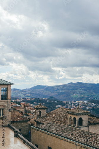 top view of village in the mountains of italy from san marino city with orange rooftops 