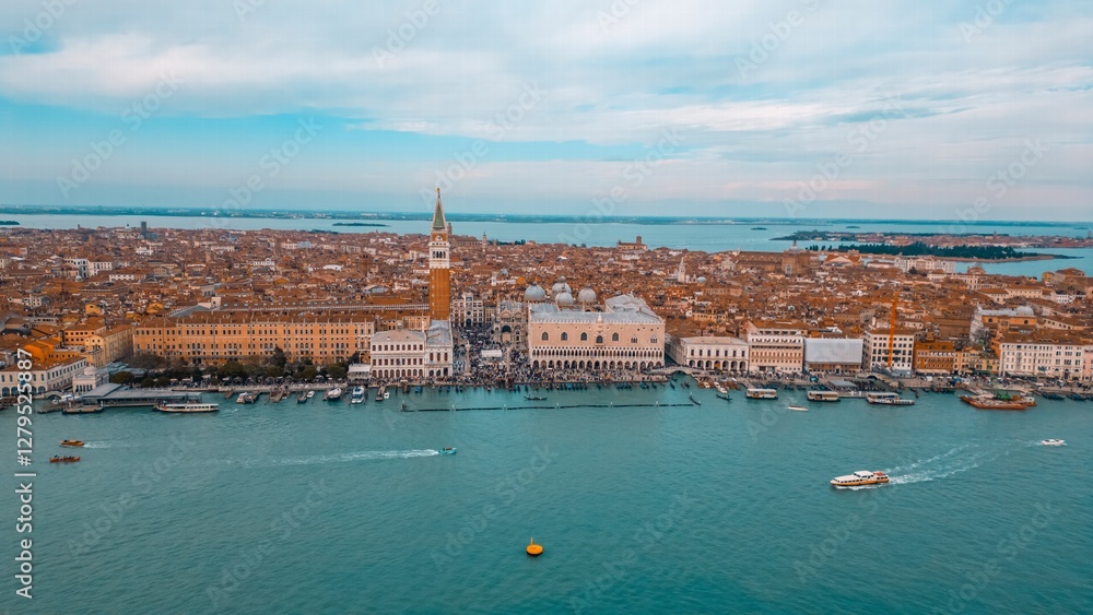 Fototapeta premium Aerial perspective captures the iconic beauty of Venice, Italy. The image showcases the historical architecture, serene waterways, and vibrant cityscape.