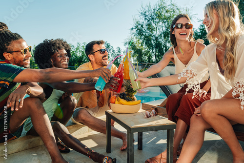 Photography Friends toasting colorful drinks at poolside party