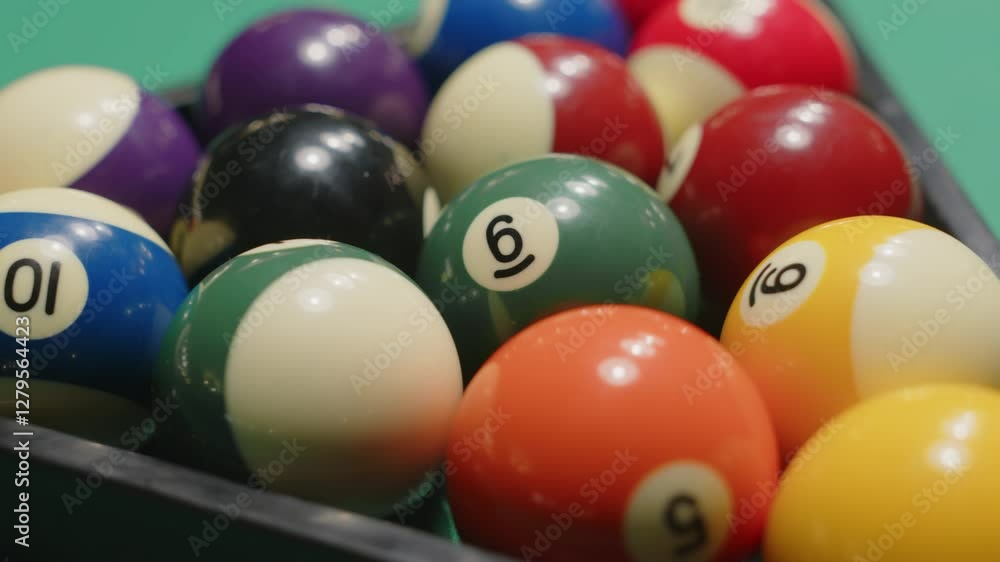 No people dolly out closeup of fifteen colorful billiard balls with numbers racked in triangle pyramid for pool No people dolly out closeup of fifteen colorful billiard balls with numbers racked in triangle pyramid for pool