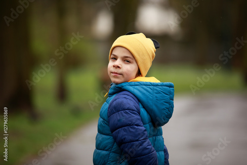 Obraz na płótnie Portrait of little adorable boy walking in park w salonie