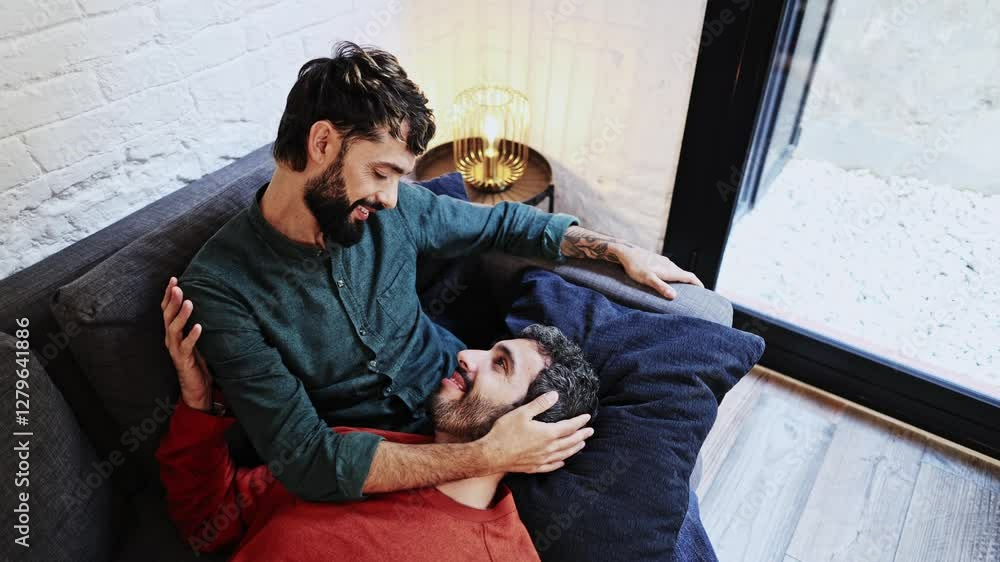 Gay couple sharing intimate moments at home Gay couple sharing intimate moments at home