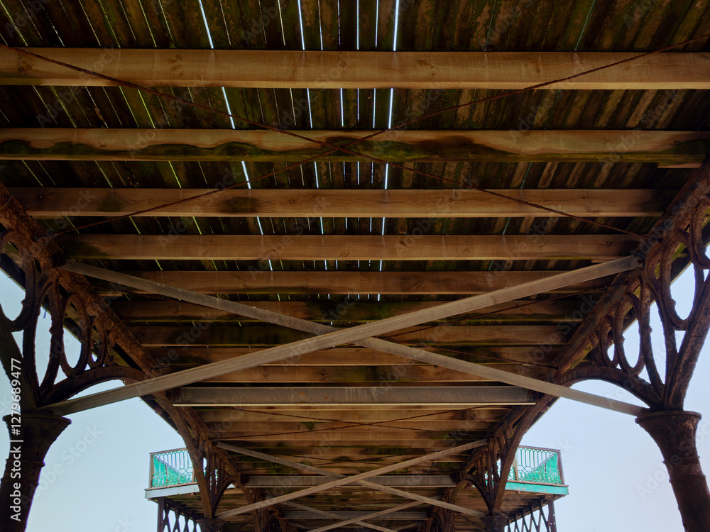 view of the underside of the Edwardian pier at Lytham St Annes on the sea showing the wood and metal structure view of the underside of the Edwardian pier at Lytham St Annes on the sea showing the wood and metal structure
