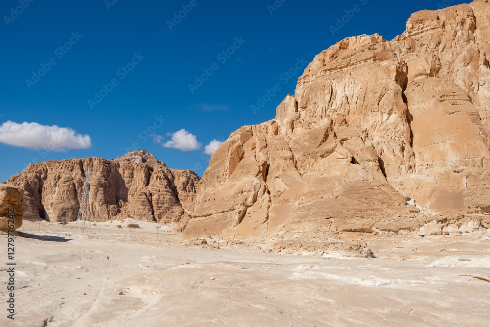 Explore the stunning rock formations of the Sinai desert in Egypt under a bright blue sky Explore the stunning rock formations of the Sinai desert in Egypt under a bright blue sky