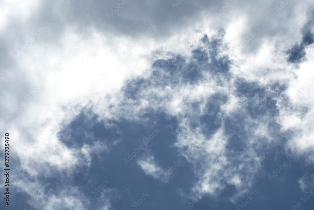 Fototapeta premium Heavy rain cloud with blue sky as background