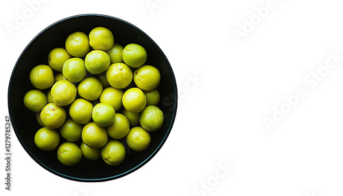 Top view of fresh green plums in a black bowl.  Possible use food photography, healthy eating photo