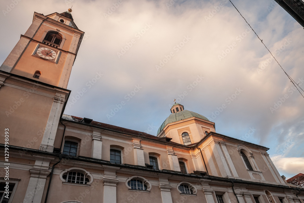 Φωτογραφία The striking baroque facade of Ljubljana Cathedral (Katedrala) features a domed roof and clock tower