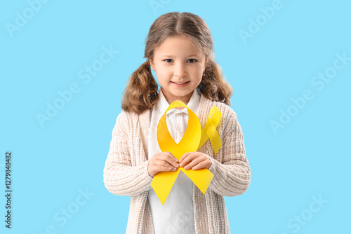 Cute little girl with yello...