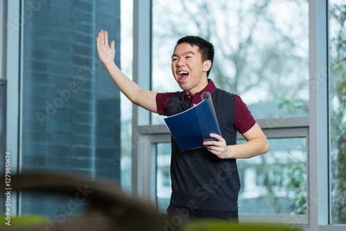 Bilde på lerret A young male high school student is performing a dramatic monologue in a classroom for drama class or club
