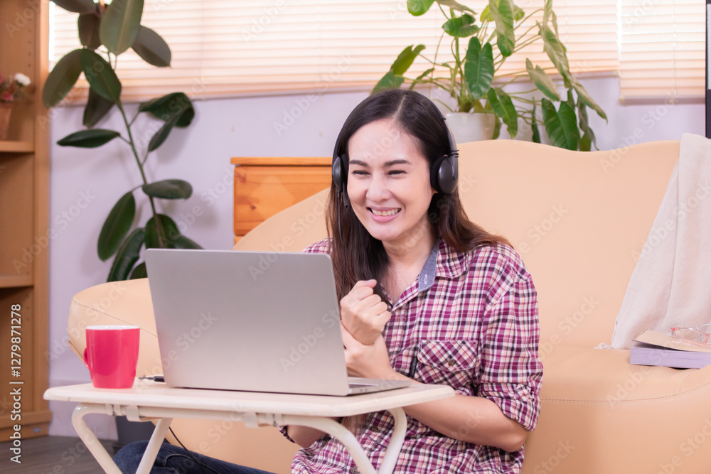 Asian woman wearing eyeglasses working at home online small business using technology laptop conference with customer, freelancer female design work on computer, modern business owner entrepreneur Asian woman wearing eyeglasses working at home online small business using technology laptop conference with customer, freelancer female design work on computer, modern business owner entrepreneur