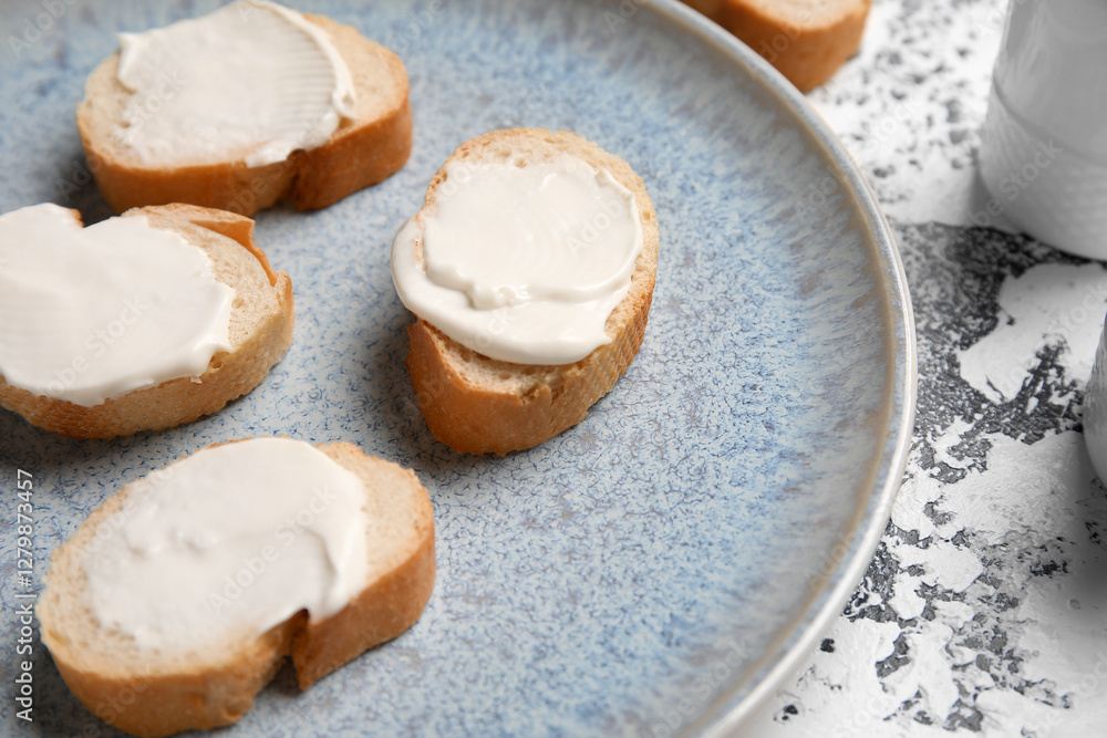 Plate of tasty bruschetta with processed cheese on grunge background, closeup Plate of tasty bruschetta with processed cheese on grunge background, closeup