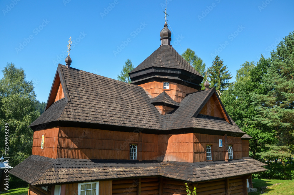 Wooden Church of the Nativity of the Blessed Virgin Mary dating in 1719 stands amidst lush green trees in a serene setting in Kryvorivnia village, Carpathian Mountains, Ukraine
Wooden Church of the Nativity of the Blessed Virgin Mary dating in 1719 stands amidst lush green trees in a serene setting in Kryvorivnia village, Carpathian Mountains, Ukraine