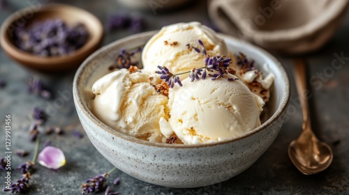 a bowl of vanilla ice cream with edible flower