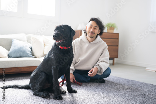 Living room owner living at home with a large dog Aim! Living room free doggie whole body photo