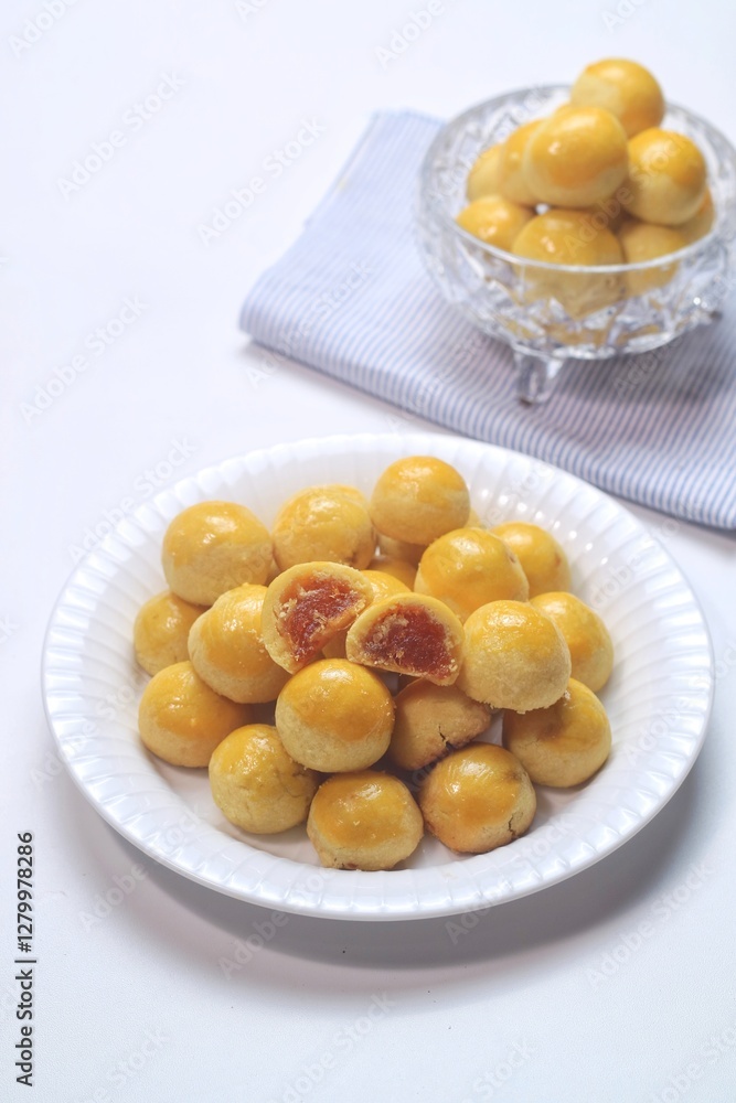 pineapple tart or nanas tart or nastar cookies. cookies with pineapple jam inside on bright mood pineapple tart or nanas tart or nastar cookies. cookies with pineapple jam inside on bright mood