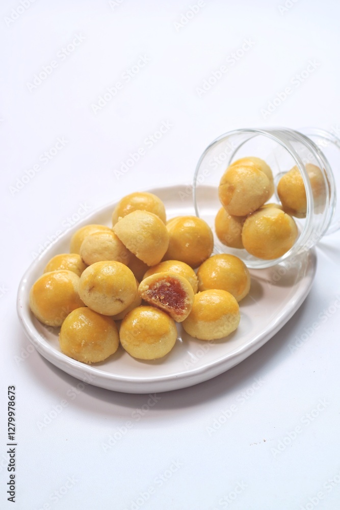 pineapple tart or nanas tart or nastar cookies. cookies with pineapple jam inside on bright mood pineapple tart or nanas tart or nastar cookies. cookies with pineapple jam inside on bright mood