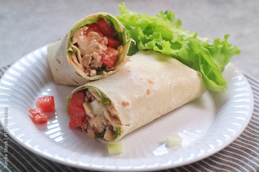 Chicken Kebab, wrap chicken with spices and veggetables with mayonaise and spicy sauce.
Chicken Kebab, wrap chicken with spices and veggetables with mayonaise and spicy sauce.