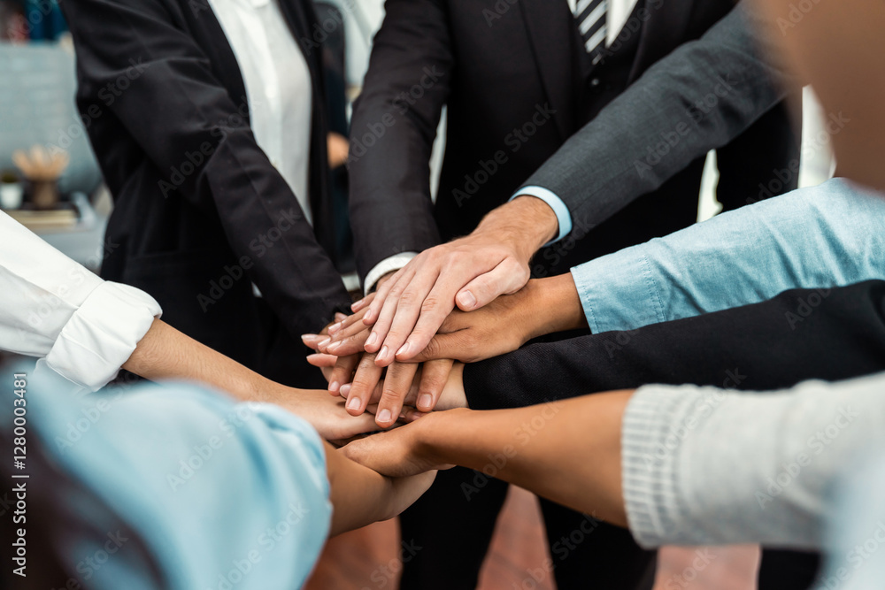 Multiracial business people make synergy hand stack together in meeting room as cooperation or team building for corporate employee in workplace. Meticulous Multiracial business people make synergy hand stack together in meeting room as cooperation or team building for corporate employee in workplace. Meticulous