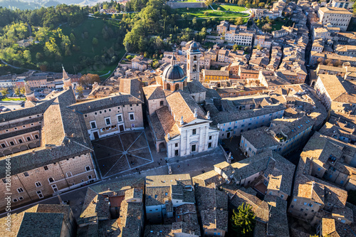 Drone cityscape with Urbino Cathedral (Cattedrale Metropolitana di Santa Maria Assunta) dedicated to the Assumption of the Blessed Virgin Mary.
