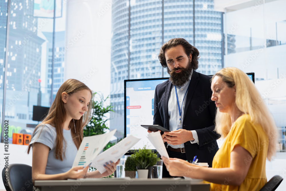 Fototapeta premium Financial advisor meeting with customers to counsel them on their finances, offering them strategy to achieve futureproof income. Economy expert giving budget management tips