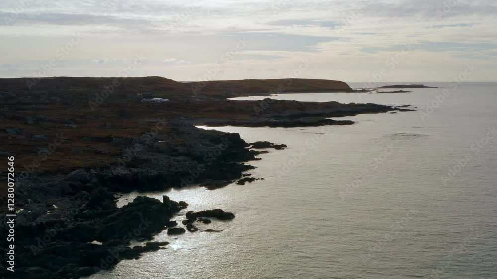 Aerial pullback over Clifden Bay coast, revealing White Lady Mystery Daytime Maritime Marker lighthouse. Aerial pullback over Clifden Bay coast, revealing White Lady Mystery Daytime Maritime Marker lighthouse.