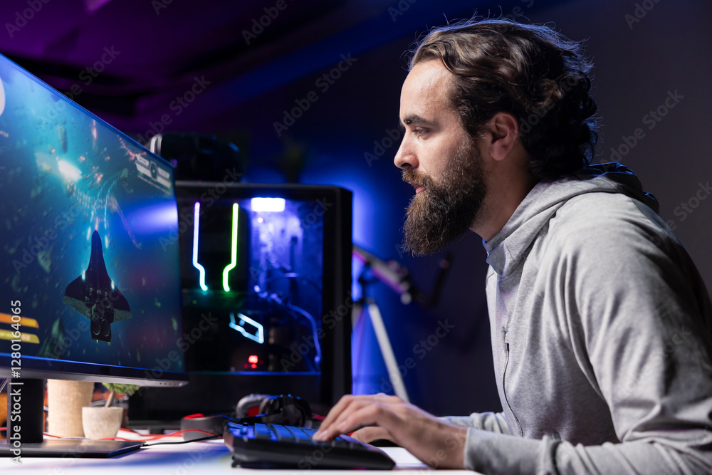 Man relaxing by playing science fiction galaxy videogame with friends on PC in RGB lit apartment late at night. Focused gamer playing with teammates, shooting enemies in online multiplayer shooter Man relaxing by playing science fiction galaxy videogame with friends on PC in RGB lit apartment late at night. Focused gamer playing with teammates, shooting enemies in online multiplayer shooter