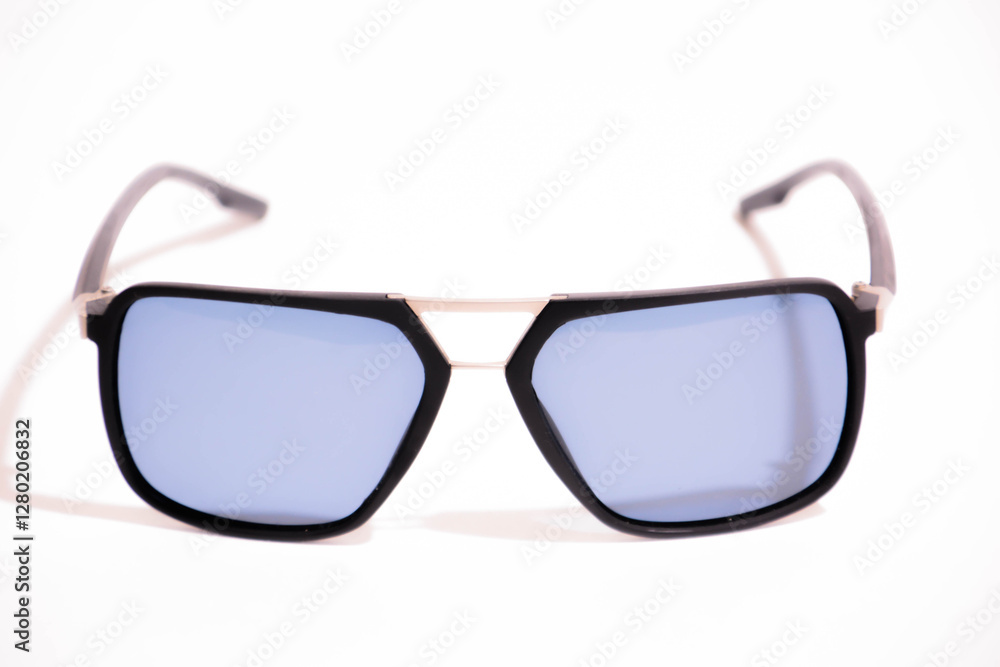 Sunglasses with black frame and blue glasses. Sun glasses. Modern blue sunglasses on white background Sunglasses with black frame and blue glasses. Sun glasses. Modern blue sunglasses on white background