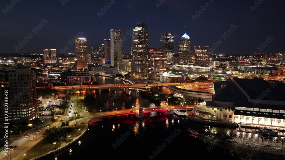 Illuminated Downtown At Tampa Florida United States. Amazing Skysrapers And Traffic On Street Viewed From Above. Night Avenue Downtown Cityscape. Night Outside Downtown. Tampa Florida. Illuminated Downtown At Tampa Florida United States. Amazing Skysrapers And Traffic On Street Viewed From Above. Night Avenue Downtown Cityscape. Night Outside Downtown. Tampa Florida.