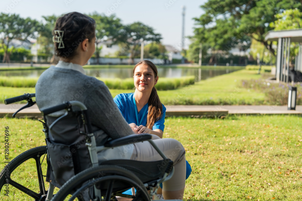 Caring nurse interacts with patient in wheelchair outdoors, showcasing compassion and support in serene garden setting Caring nurse interacts with patient in wheelchair outdoors, showcasing compassion and support in serene garden setting