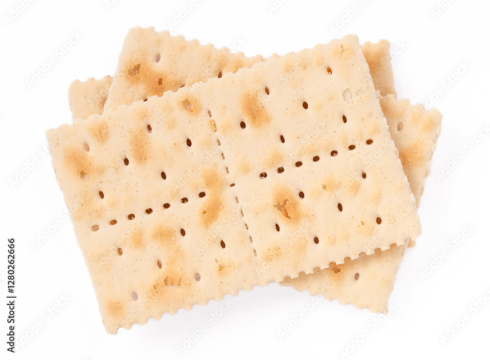 Close-up of crispy saltine crackers isolated on a white background. Simple and classic snack, perfect for food photography, culinary projects, and product presentations. Close-up of crispy saltine crackers isolated on a white background. Simple and classic snack, perfect for food photography, culinary projects, and product presentations.