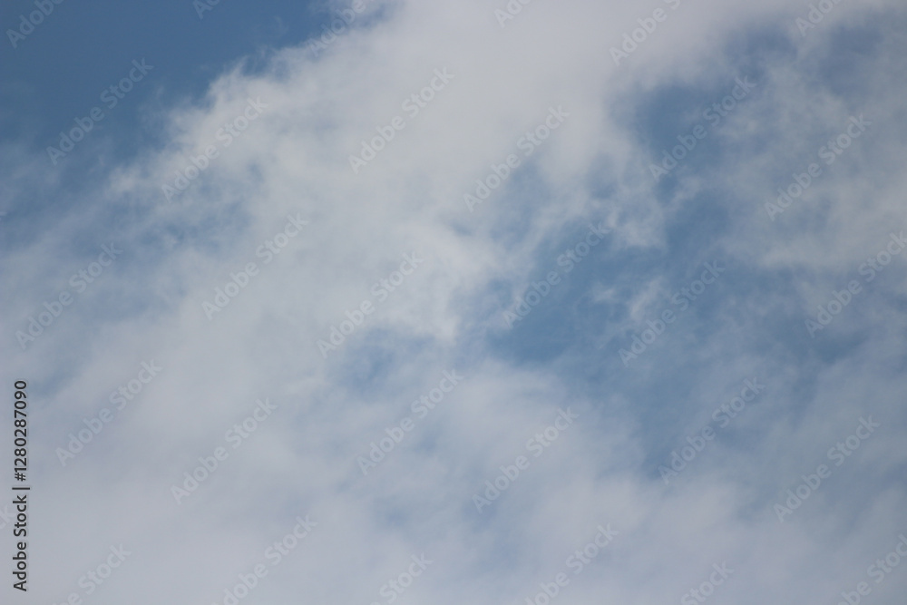 Skybound Serenity: A mesmerizing shot capturing the expansive, beautiful sky, adorned with fluffy, ethereal clouds that evoke a sense of peace. Skybound Serenity: A mesmerizing shot capturing the expansive, beautiful sky, adorned with fluffy, ethereal clouds that evoke a sense of peace.