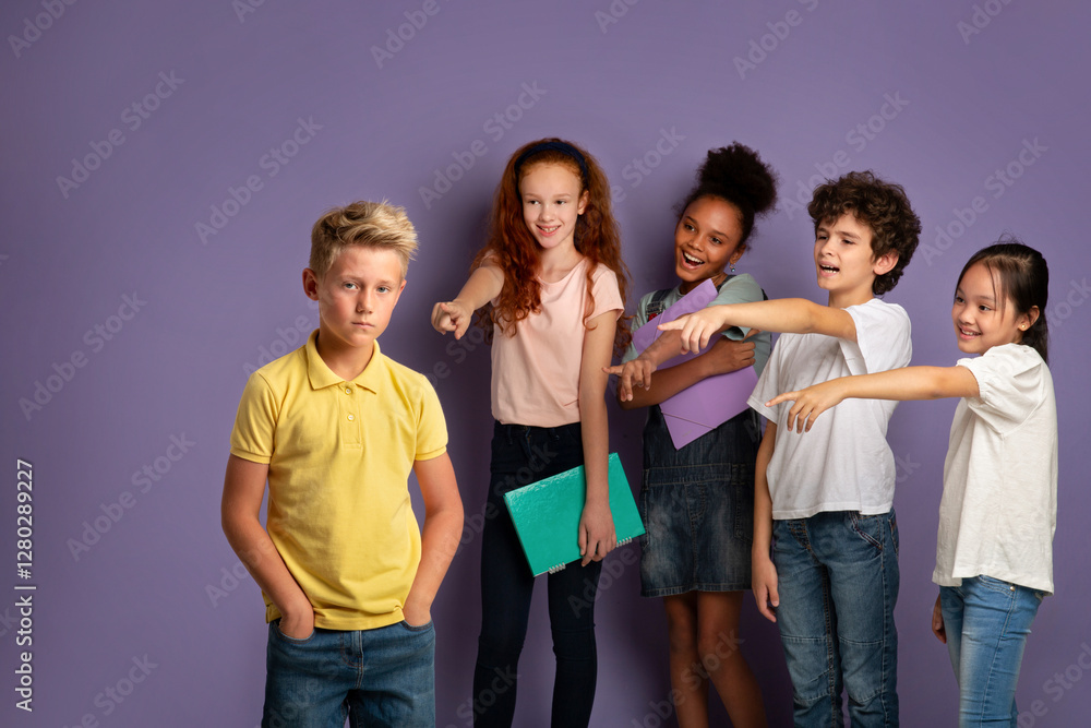 © Prostock-studio - Stop bullying at schools concept. Vicious kids laughing at sad blonde boy over lilac background