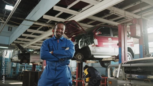 Wallpaper Mural Portrait of confident Black male mechanic inspector, cheerful works and arms crossed with smile in fix car garage, professional engineer check jobs in automotive and transportation industry business. Torontodigital.ca
