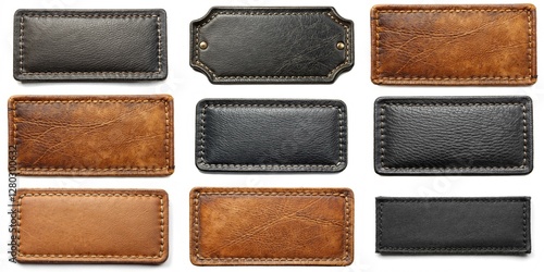 A collection of leather tags with different colors and designs. The tags are arranged in a row, with some being brown and others black. The tags have a vintage and rustic feel to them