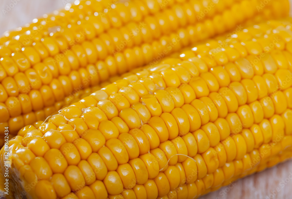 Delicious sweet boiled corn cobs on plate. Healthy food concept Delicious sweet boiled corn cobs on plate. Healthy food concept