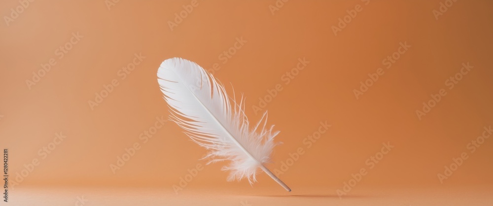 Naklejka premium Single White Feather on Orange Background