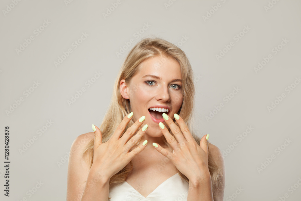 Happy surprised excited woman. Female model with blond hairstyle and clean skin, facial treatment, skin care and beauty concept Happy surprised excited woman. Female model with blond hairstyle and clean skin, facial treatment, skin care and beauty concept