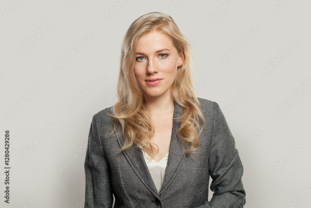 Portrait of nice business woman in suit looking at camera Portrait of nice business woman in suit looking at camera